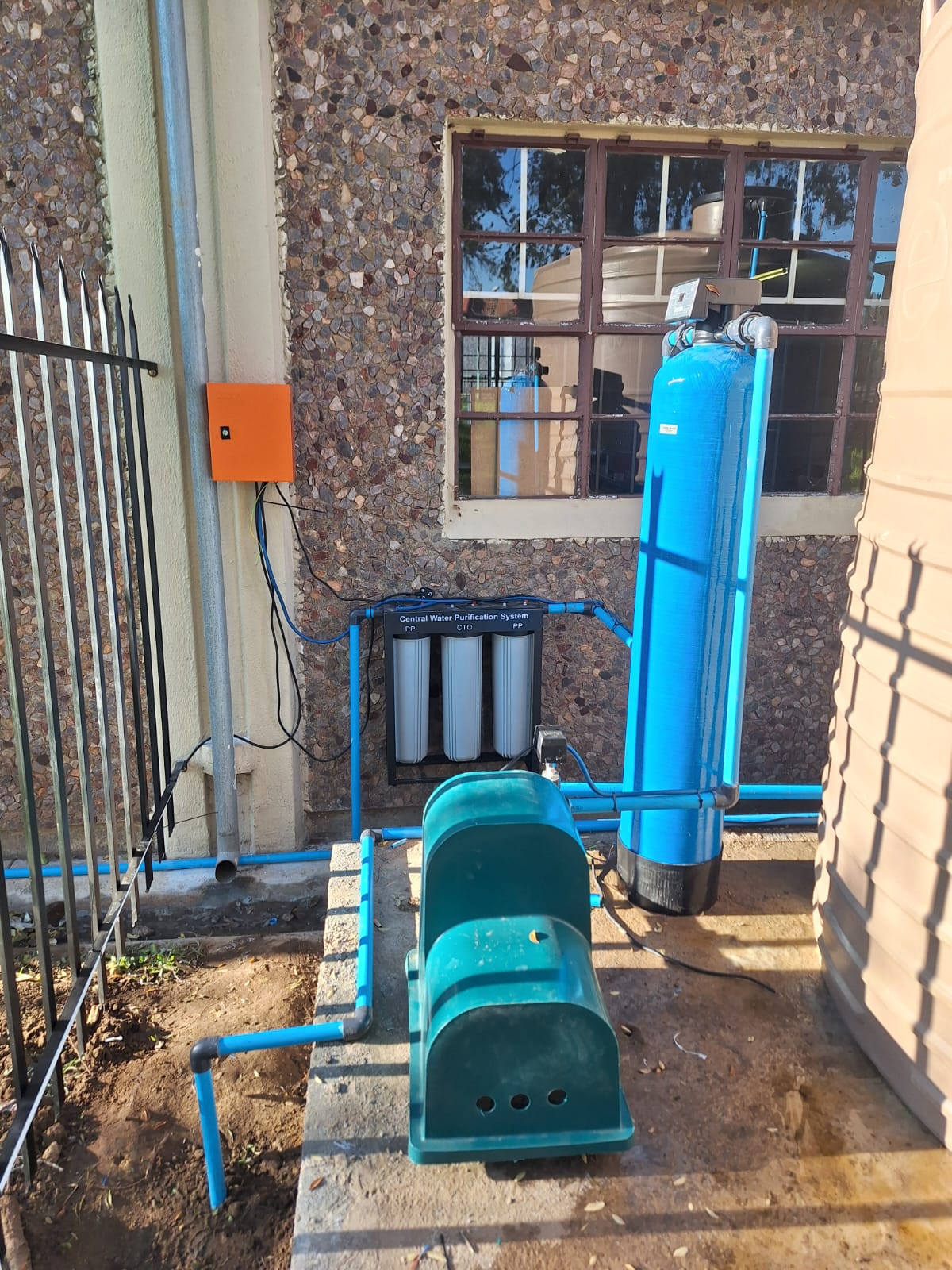 Water treatment filters and pump housing installation
